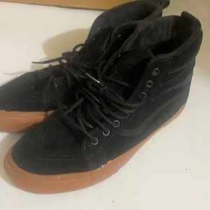 All black suede Vans with fur interior